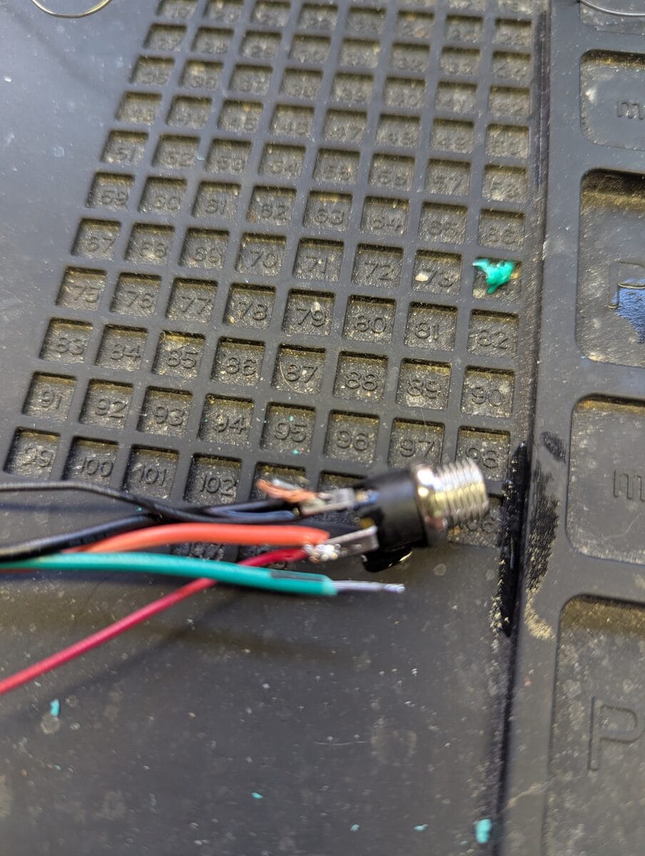 Wiring the barrel jack power connector on a soldering mat