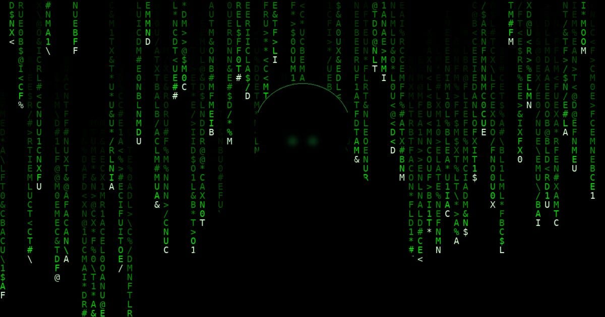 A hooded figure silhouetted in green digital rain, glowing eyes visible beneath the hood